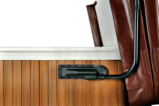 A black cover lift system attached to a wooden spa cover, designed to lift and cover the spa.